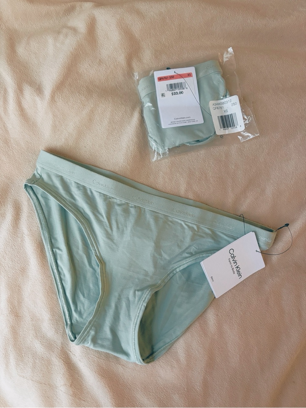 Two pairs of XS Calvin Klein bikini style underwear